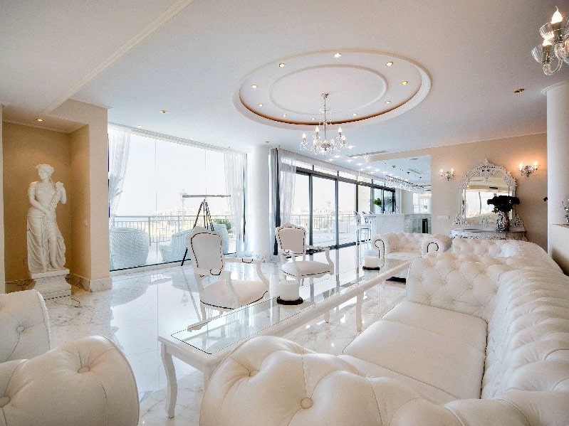 Lavish living room of Portomaso penthouse, enjoying stunning sea views. 