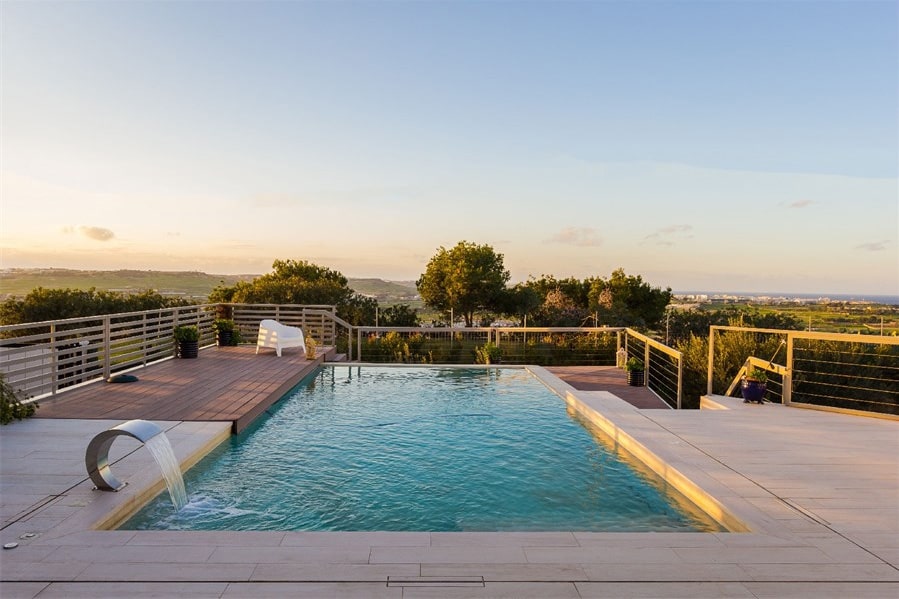 Peaceful pool area overlooking open Maltese countryside and sea views, Naxxar, northern Malta.